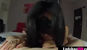 Cute ladyboy in a fetish mask gives a POV style blowjob